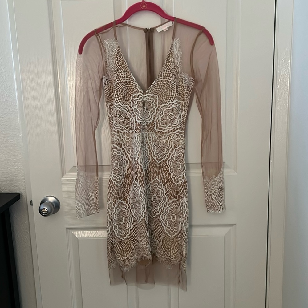 Sheer, nude dress made by Luxxel. XS